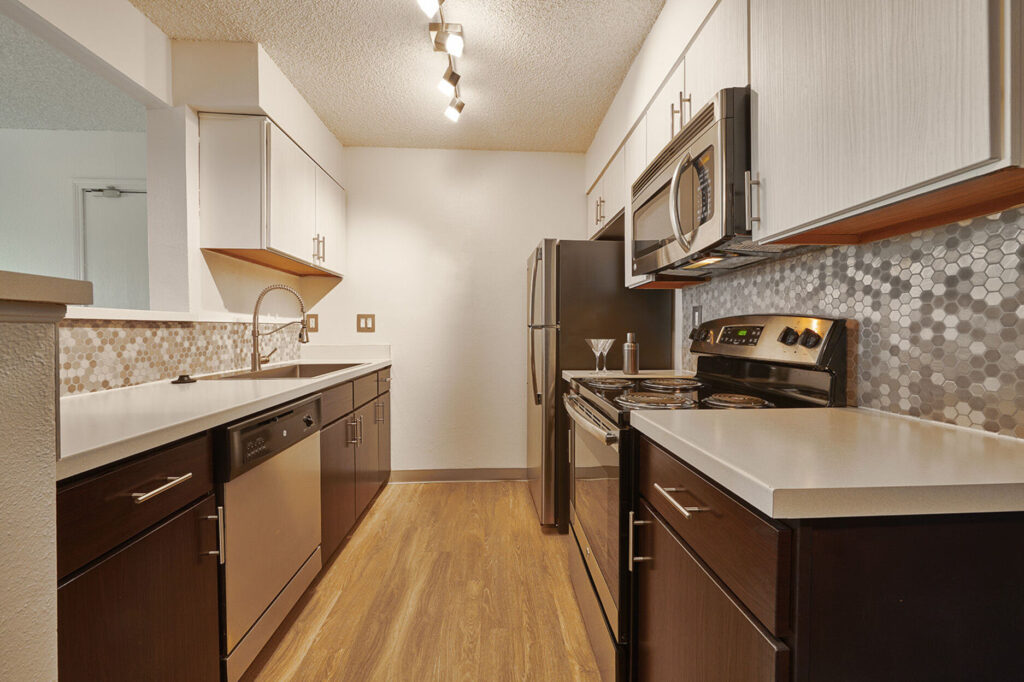Luxury kitchen with stainless steel appliances at Greenwood Point apartments in Englewood